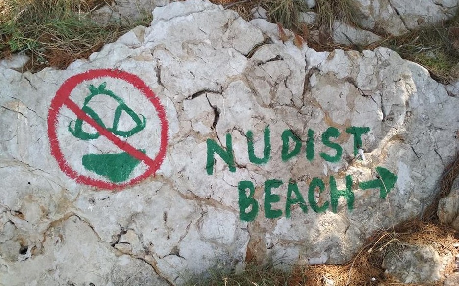 sign to the nugal nudist beach